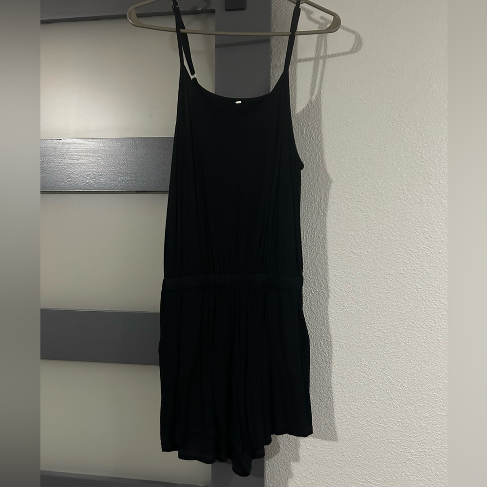 Black spaghetti strap shorts romper. Worn once. Large. Excellent used condition.